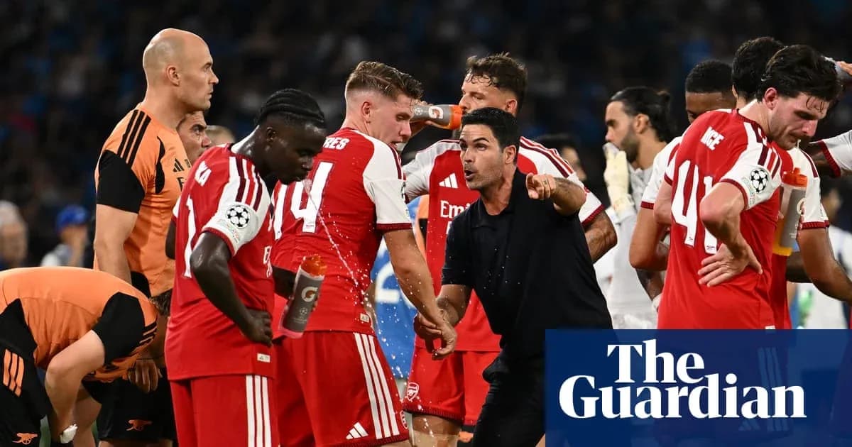 Arsenal players gather around coach during match break Arsenal players gather around coach during match break