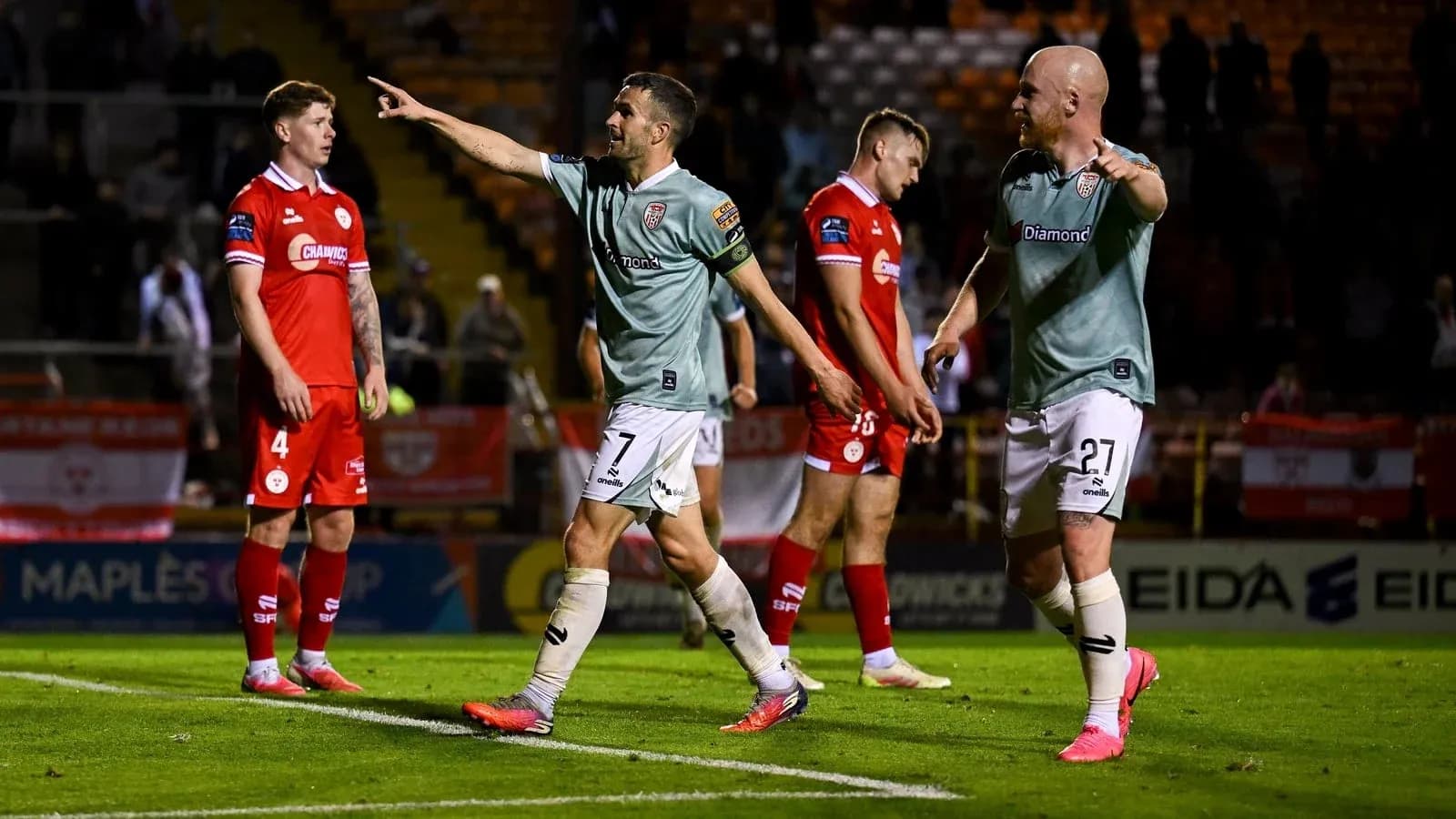 Players celebrating after a goal in a match Players celebrating after a goal in a match