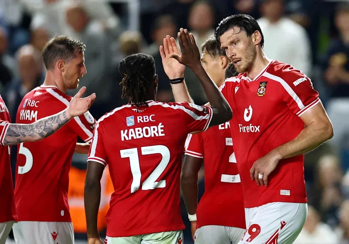 Players celebrating after scoring a goal during match Players celebrating after scoring a goal during match
