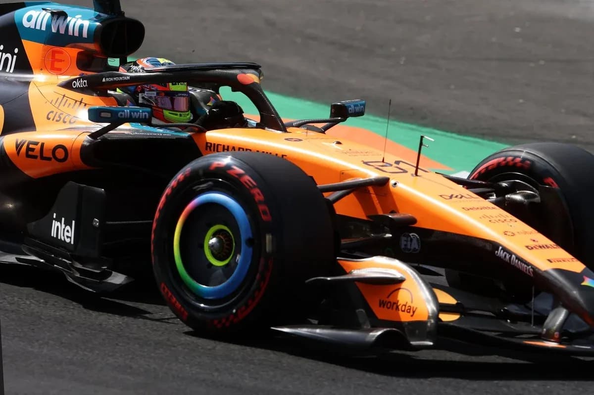 McLaren Formula 1 car racing on track McLaren Formula 1 car racing on track