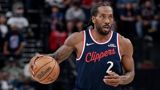 Player dribbling basketball during game Player dribbling basketball during game