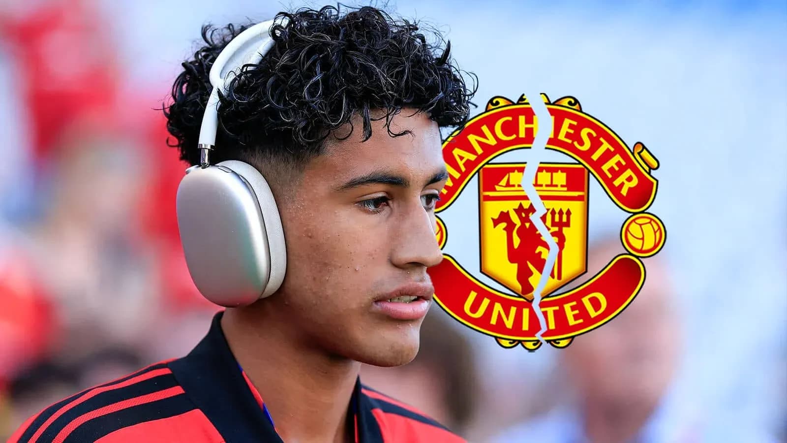Player wearing headphones before match with Manchester United logo Player wearing headphones before match with Manchester United logo