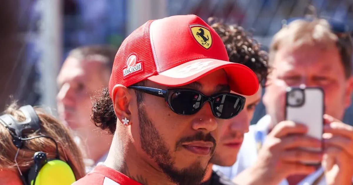 Driver wearing Ferrari cap and sunglasses in crowd Driver wearing Ferrari cap and sunglasses in crowd