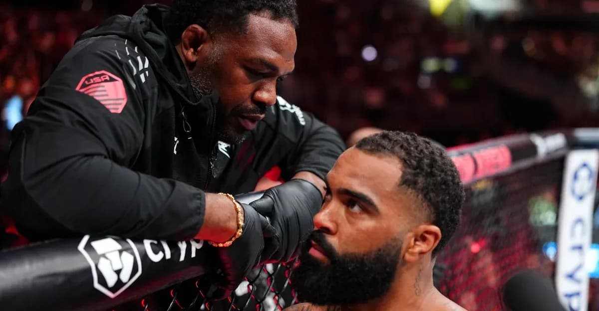 Coach advising fighter during MMA match preparation Coach advising fighter during MMA match preparation