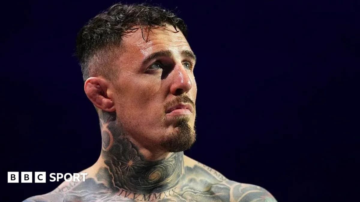 Tattooed fighter looking up during match Tattooed fighter looking up during match