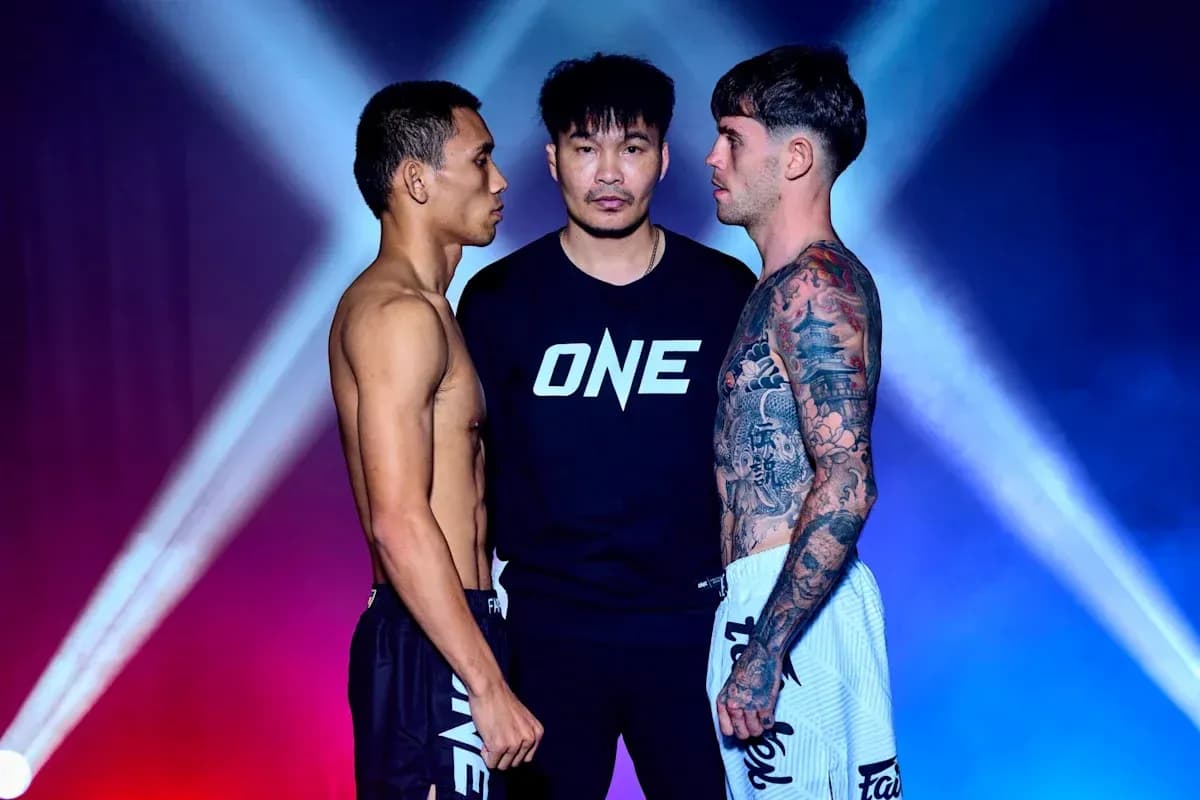 Two fighters facing off with a referee between them Two fighters facing off with a referee between them