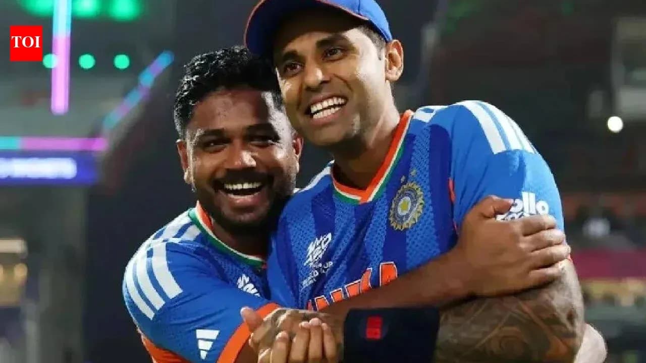 Two cricketers celebrating together on the field Two cricketers celebrating together on the field