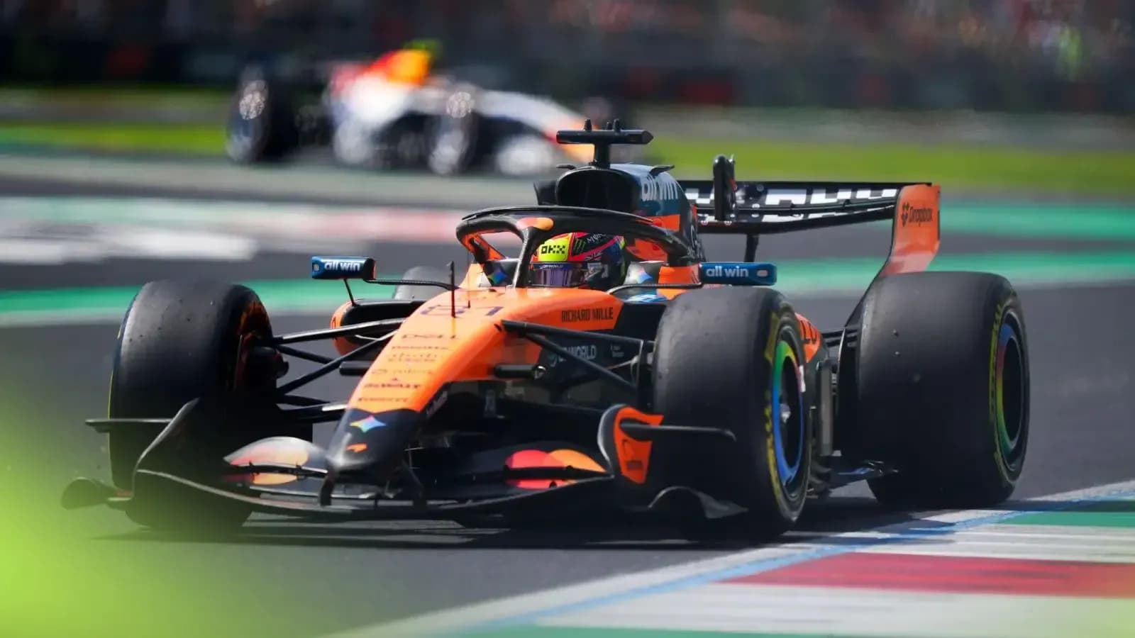 McLaren F1 car racing on track during event McLaren F1 car racing on track during event