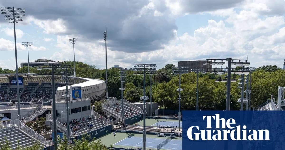 View of tennis courts and stadium under cloudy sky View of tennis courts and stadium under cloudy sky