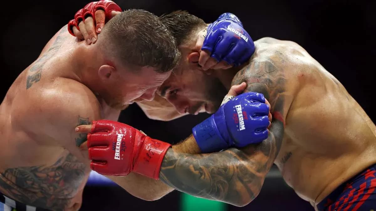Two fighters in a clinch during a match Two fighters in a clinch during a match