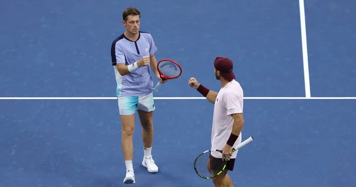 Two tennis players celebrating a point on court Two tennis players celebrating a point on court