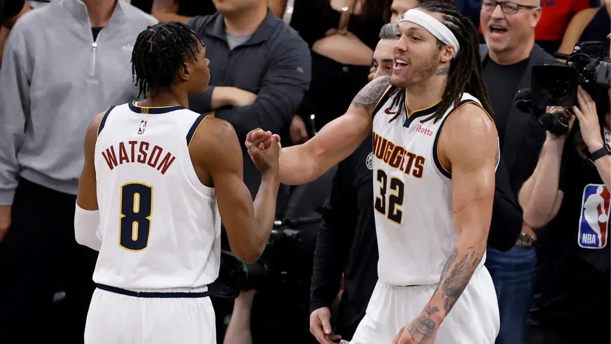Two basketball players celebrating during a game Two basketball players celebrating during a game