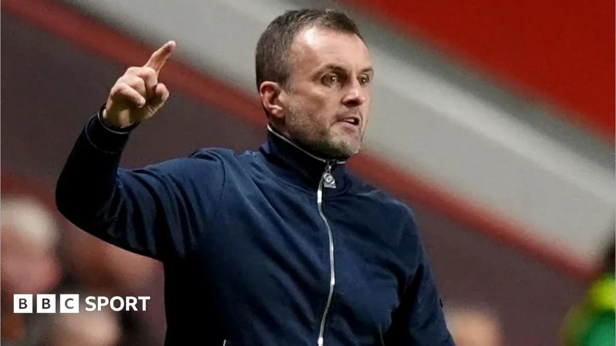 Manager gesturing during a match on the sidelines Manager gesturing during a match on the sidelines