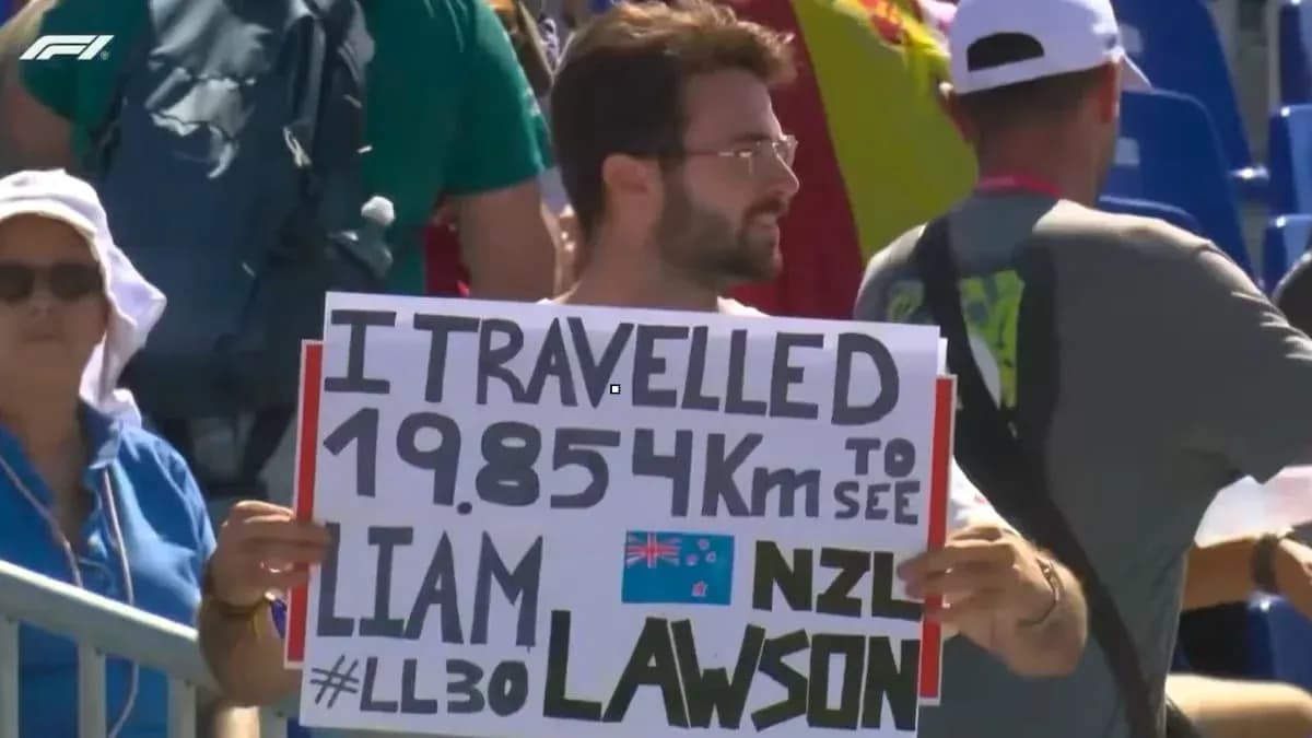 Fan holding sign for Liam Lawson at event Fan holding sign for Liam Lawson at event