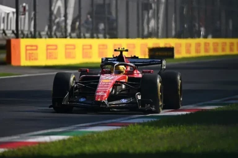 Ferrari car racing on track at Monza circuit Ferrari car racing on track at Monza circuit
