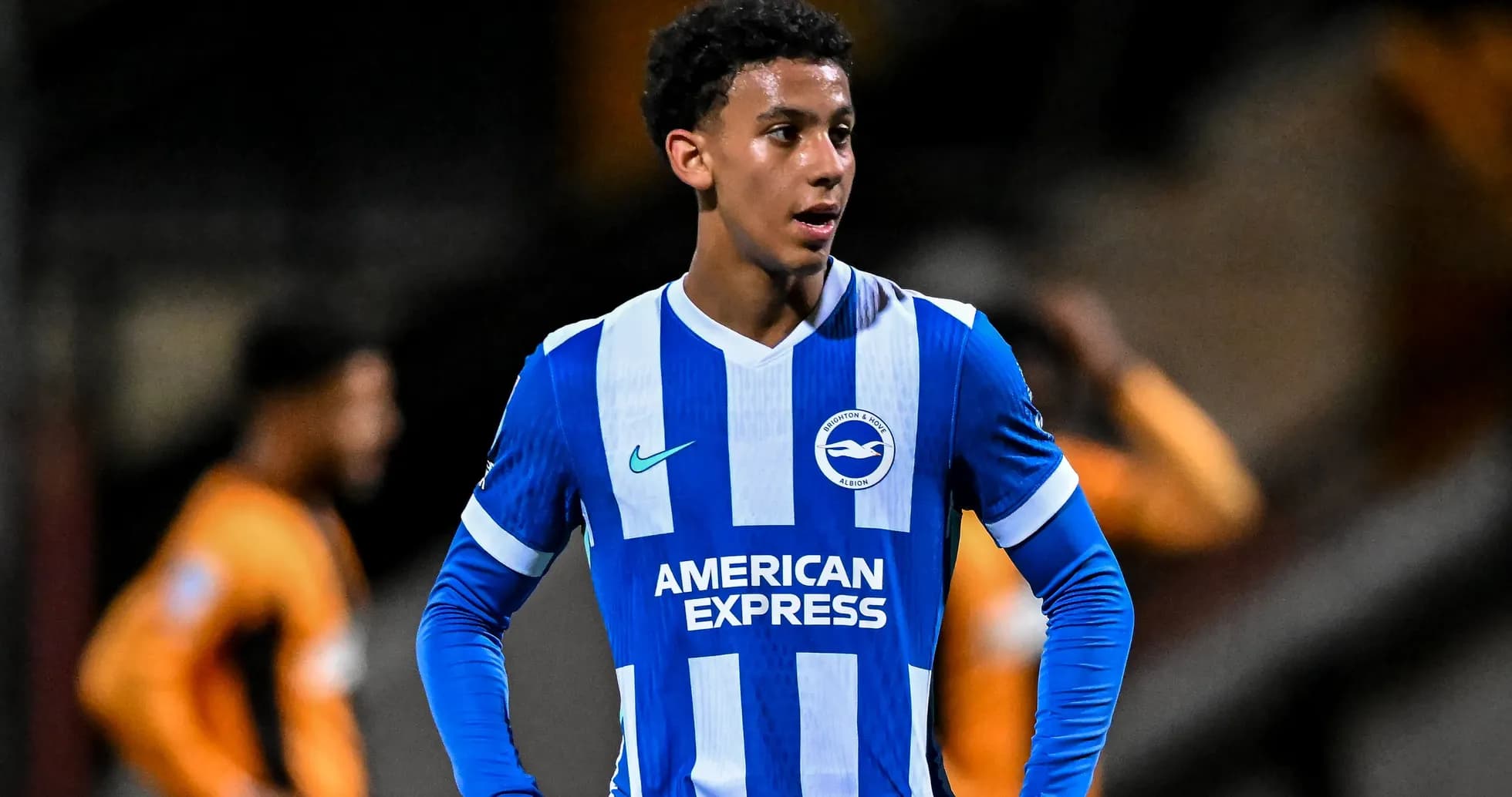 Player in Brighton & Hove Albion kit on field Player in Brighton & Hove Albion kit on field