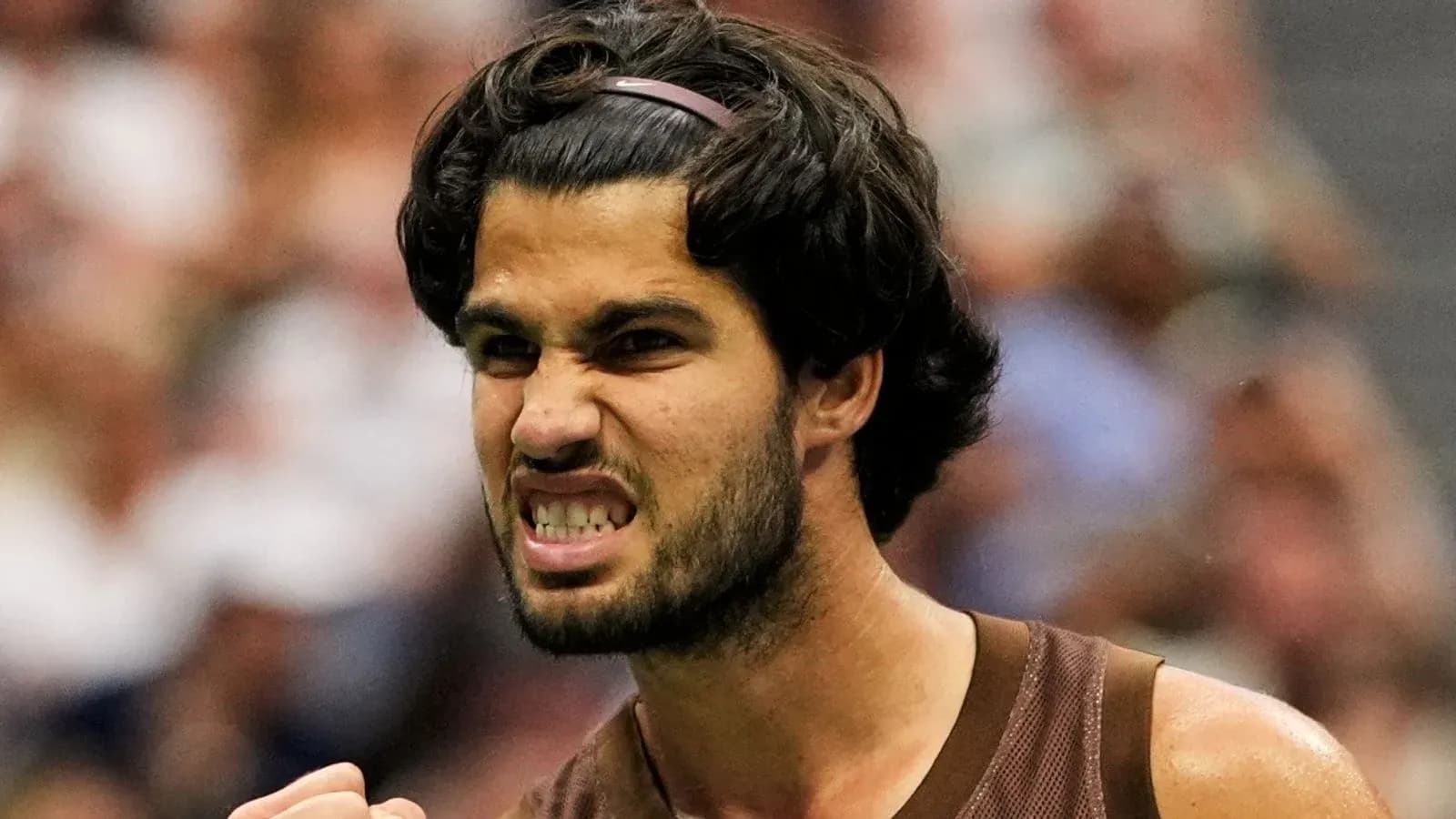 Tennis player celebrating a point during match Tennis player celebrating a point during match