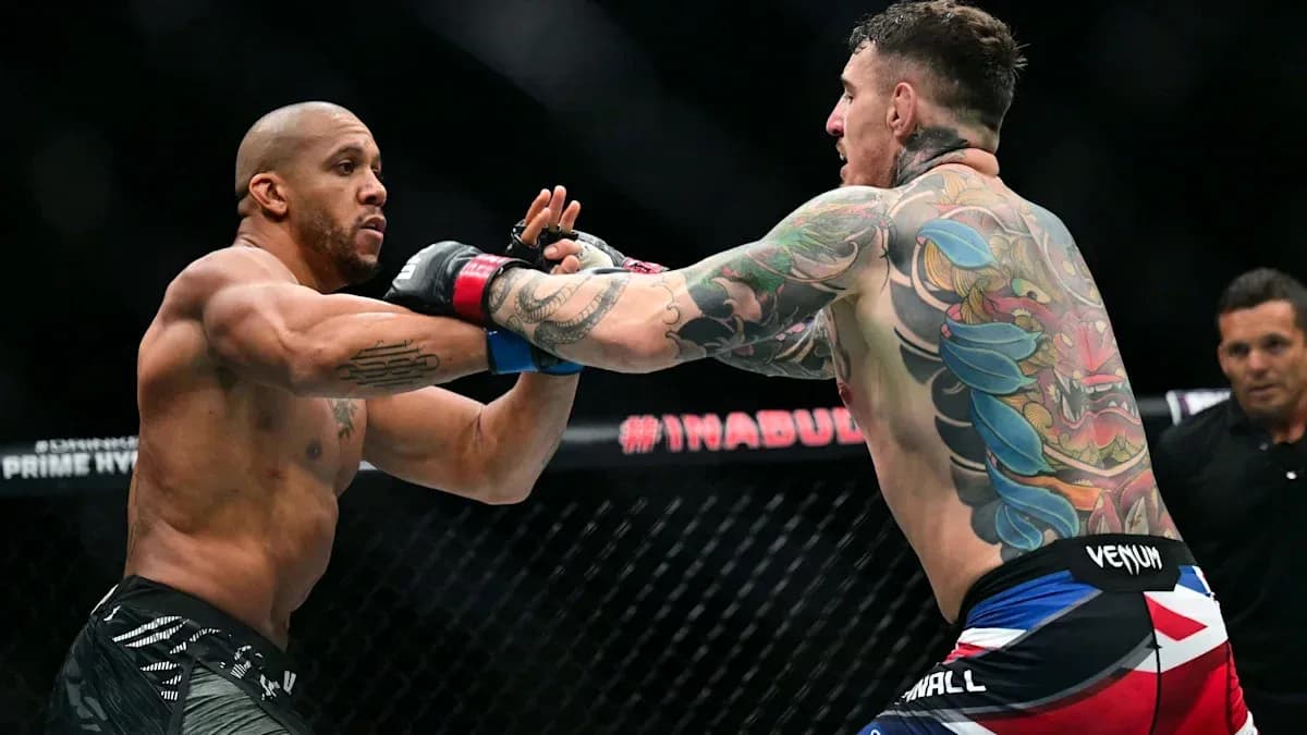 Two fighters exchanging strikes in MMA match Two fighters exchanging strikes in MMA match