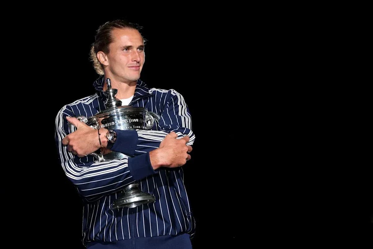 Player holding trophy during victory celebration Player holding trophy during victory celebration