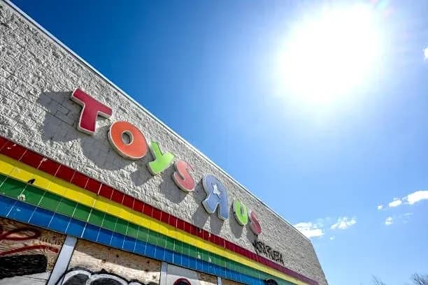 Exterior of Toys R Us store with bright sun Exterior of Toys R Us store with bright sun