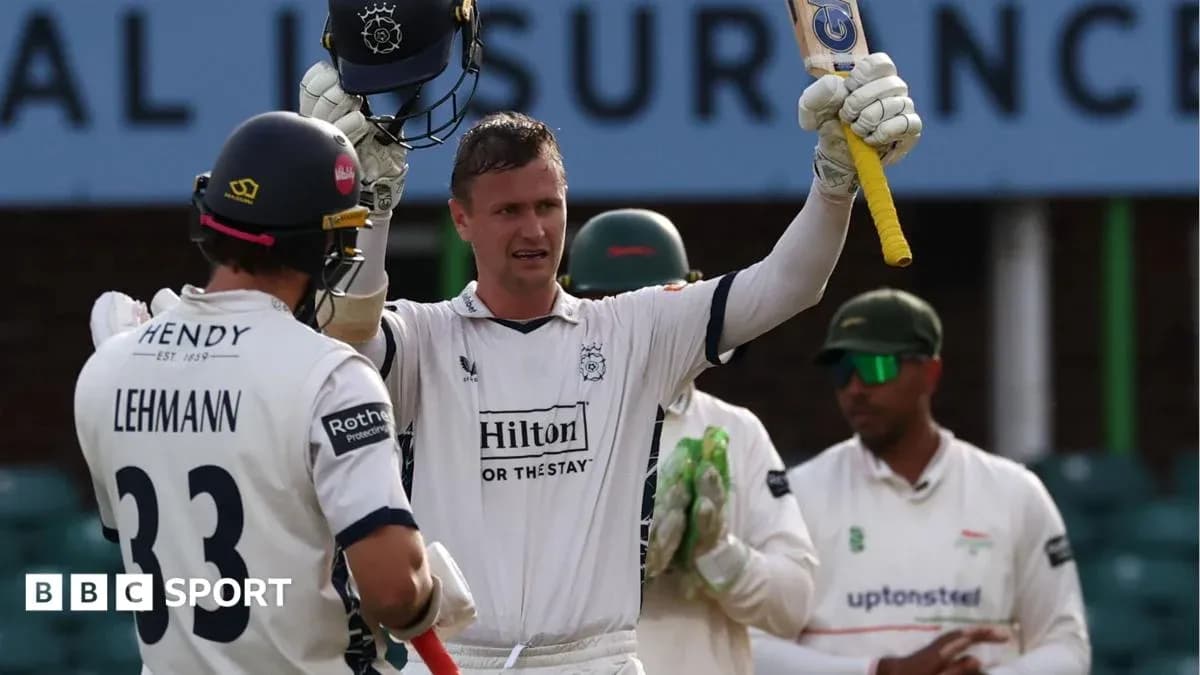 Batsman celebrating a milestone with teammates nearby Batsman celebrating a milestone with teammates nearby
