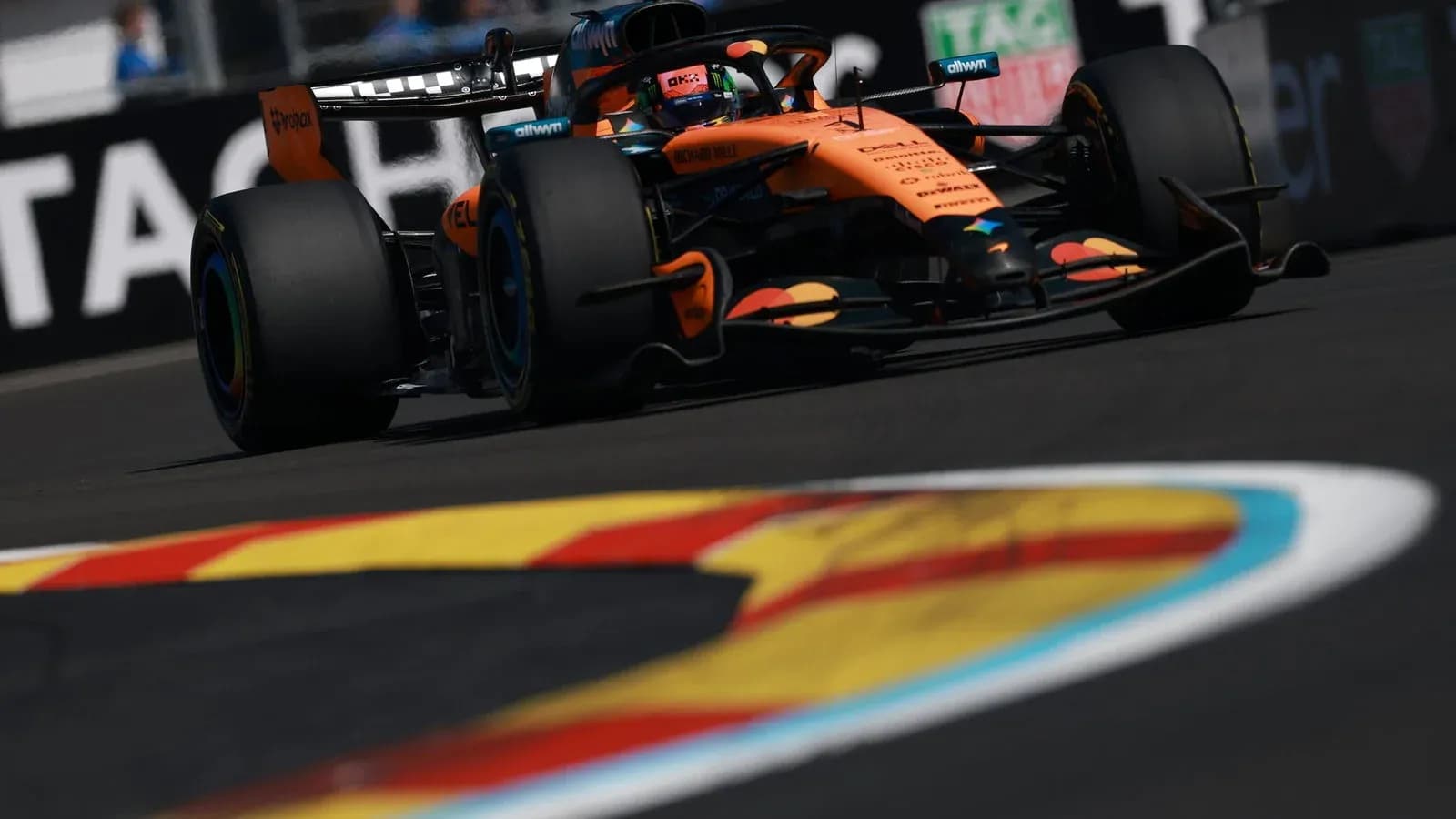 McLaren Formula 1 car racing on track McLaren Formula 1 car racing on track