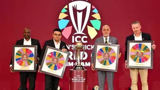 Four officials holding framed artworks at ICC event Four officials holding framed artworks at ICC event