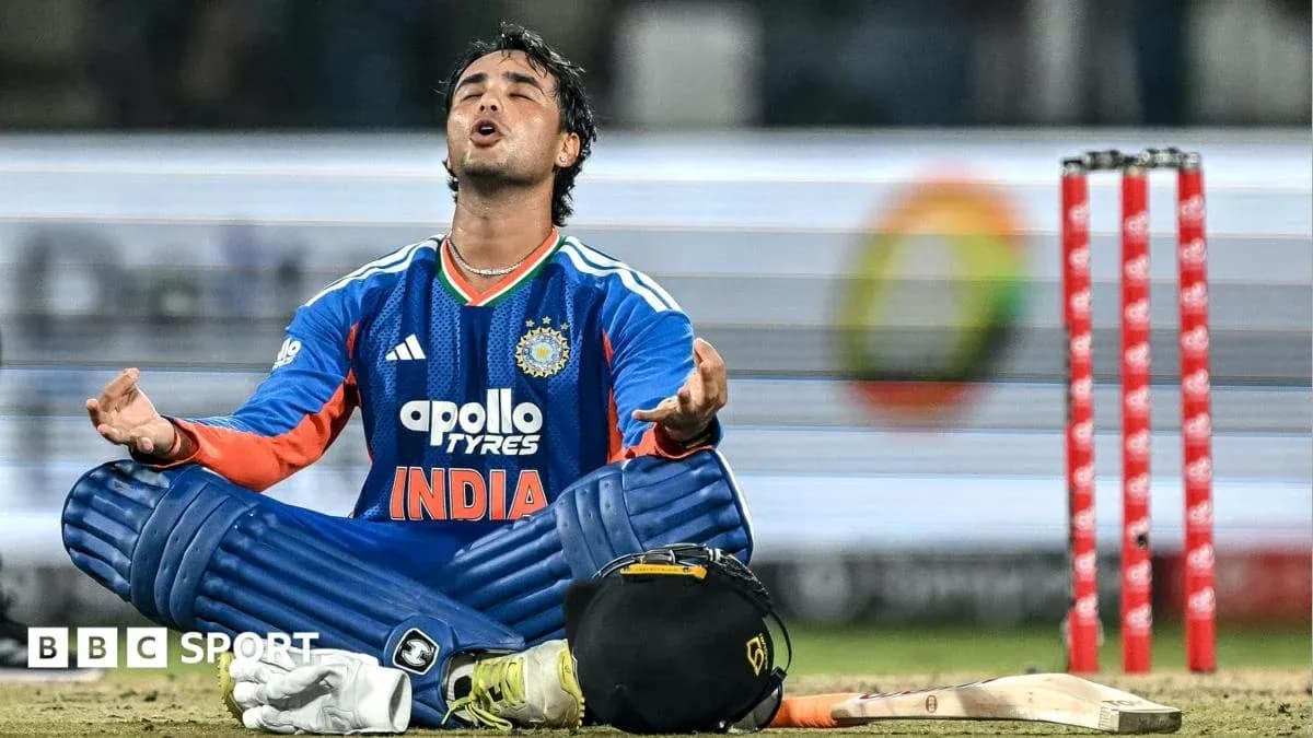 Cricketer sitting on ground after match conclusion Cricketer sitting on ground after match conclusion
