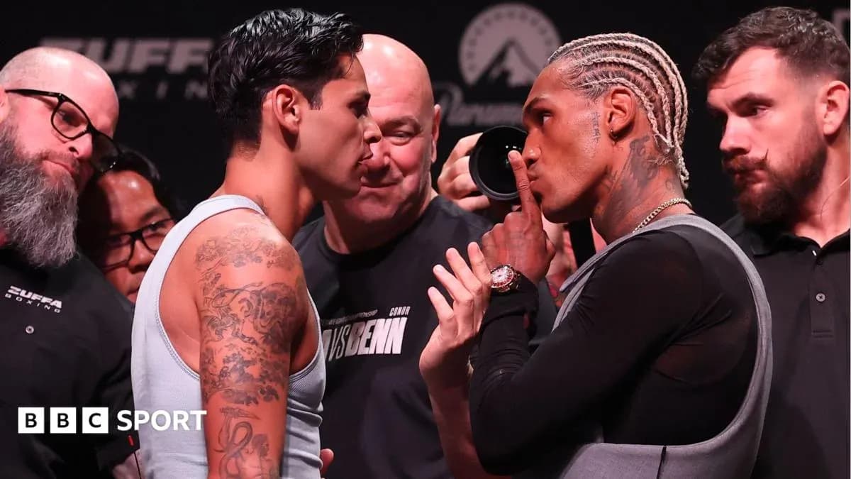 Two boxers face-off at weigh-in event Two boxers face-off at weigh-in event