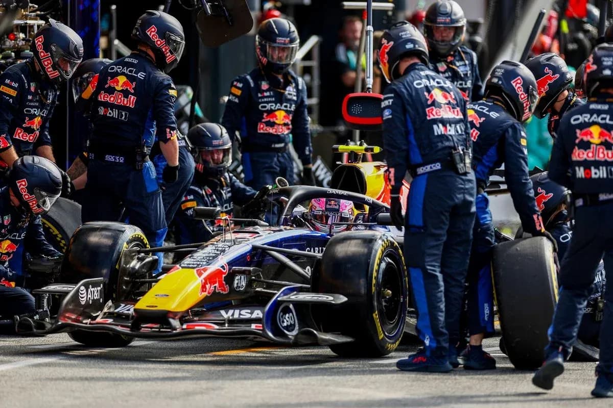 Red Bull Racing team performing a pit stop Red Bull Racing team performing a pit stop