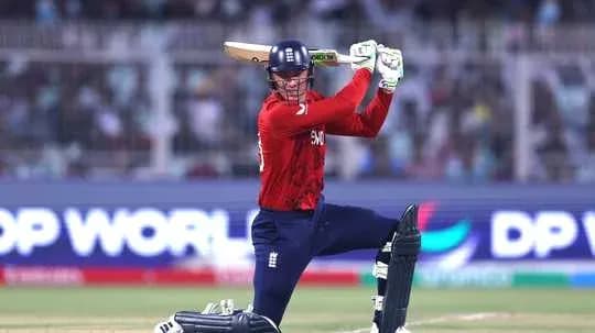 Batsman preparing to hit ball during cricket match Batsman preparing to hit ball during cricket match