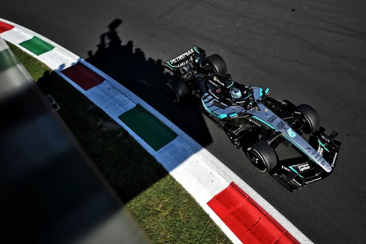 Formula 1 car navigating a track corner Formula 1 car navigating a track corner