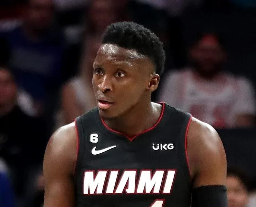 Basketball player in Miami Heat jersey during game Basketball player in Miami Heat jersey during game