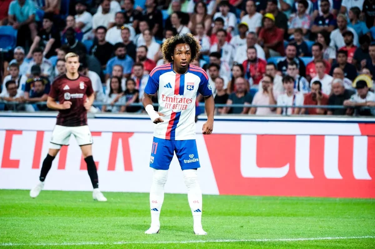 Player in Lyon kit during match with spectators Player in Lyon kit during match with spectators