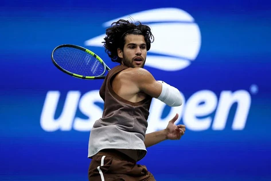 Player hitting a backhand shot at US Open Player hitting a backhand shot at US Open