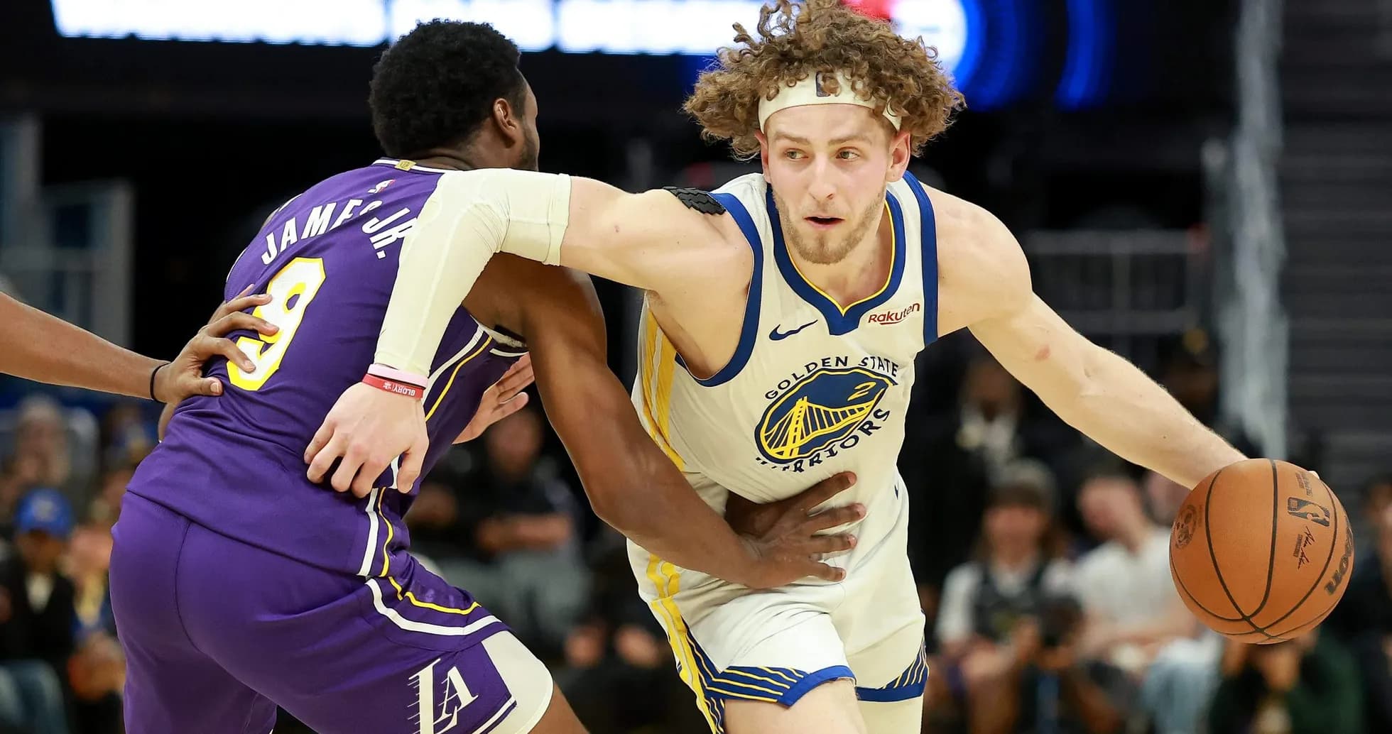 Player dribbling ball while being guarded during game Player dribbling ball while being guarded during game