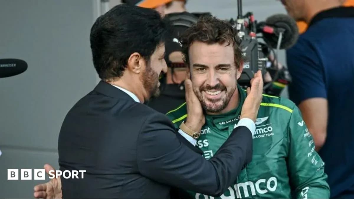 Two men interacting in a motorsport environment Two men interacting in a motorsport environment