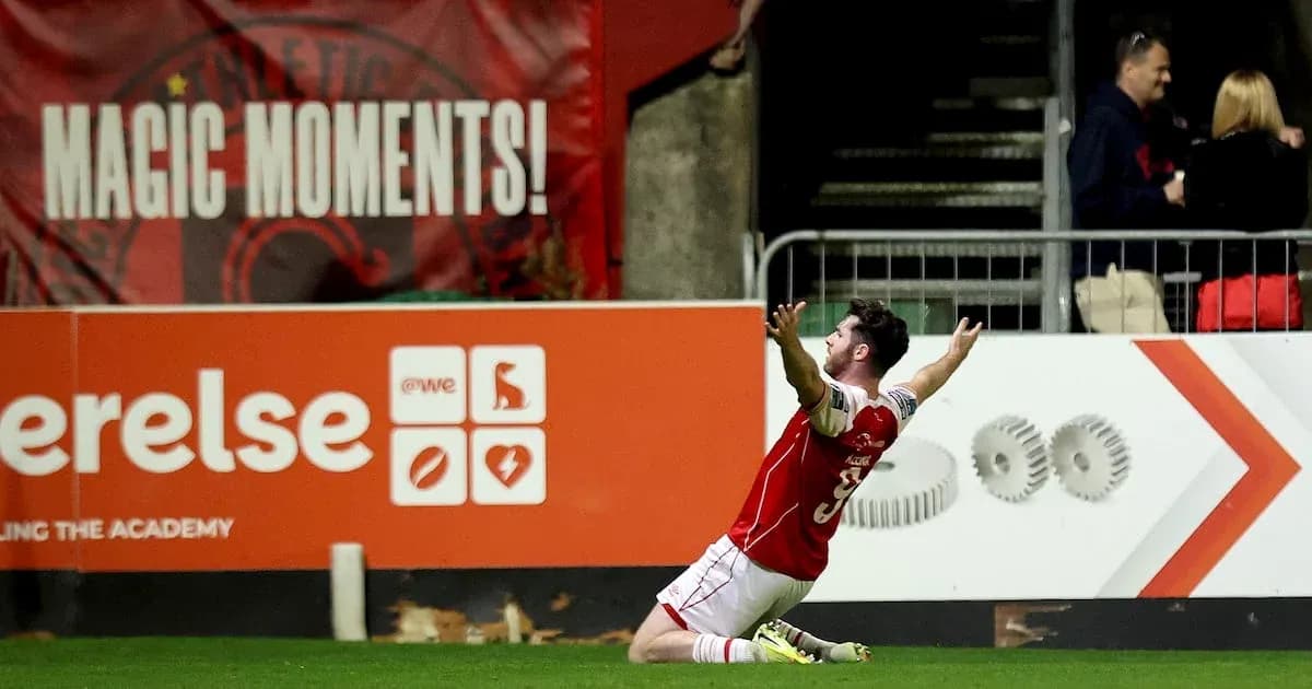 Player celebrating on the field after scoring Player celebrating on the field after scoring