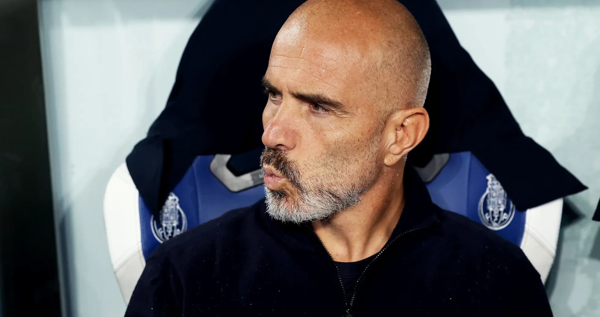 Coach sitting on bench during match Coach sitting on bench during match