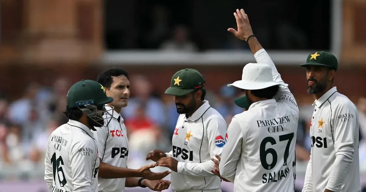 Pakistani cricket players celebrating a wicket on field Pakistani cricket players celebrating a wicket on field