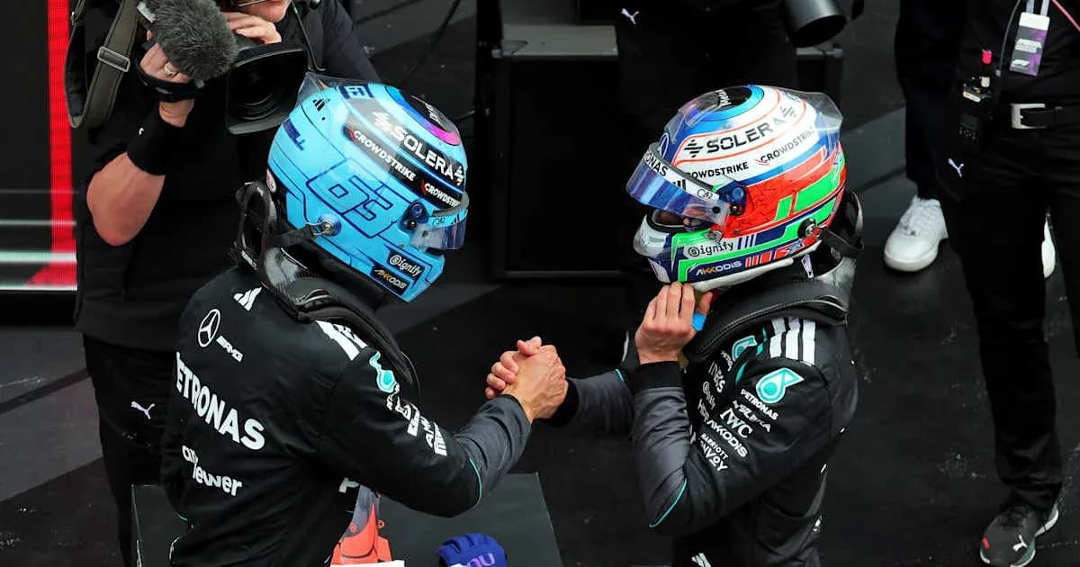 Two Formula 1 drivers shaking hands post-race Two Formula 1 drivers shaking hands post-race