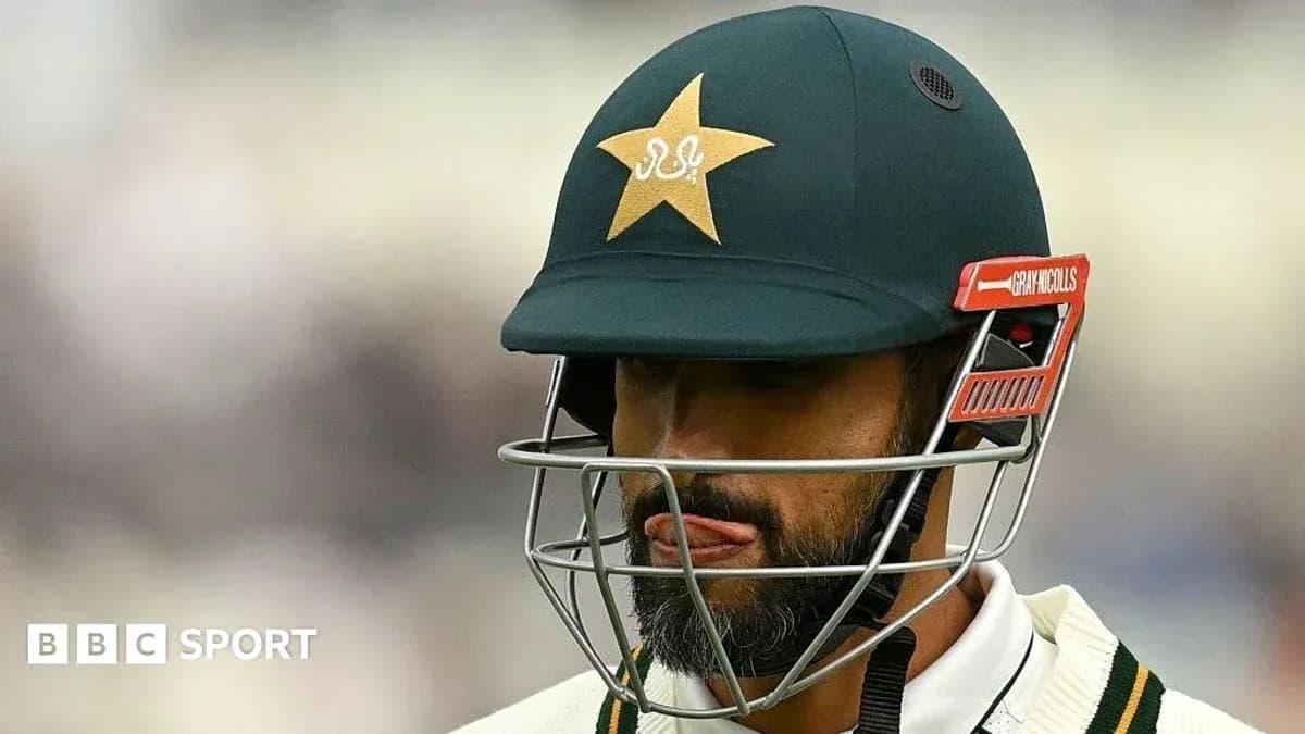 Cricketer wearing helmet with Pakistan logo Cricketer wearing helmet with Pakistan logo