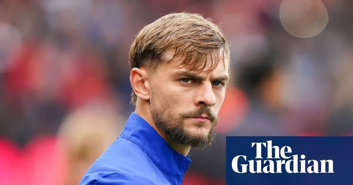Player in blue kit looking focused before match Player in blue kit looking focused before match