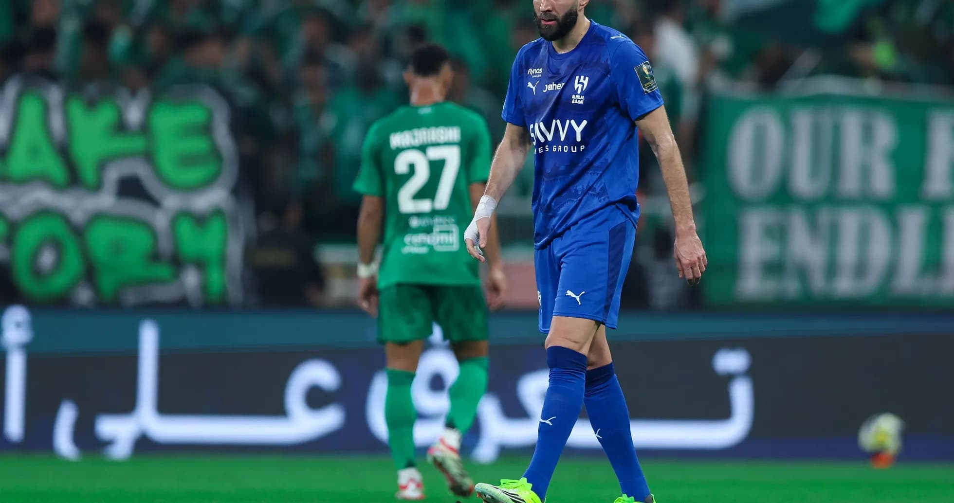 Players on the field during a football match Players on the field during a football match