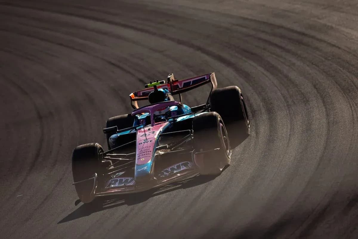 Race car navigating a curve on the track Race car navigating a curve on the track