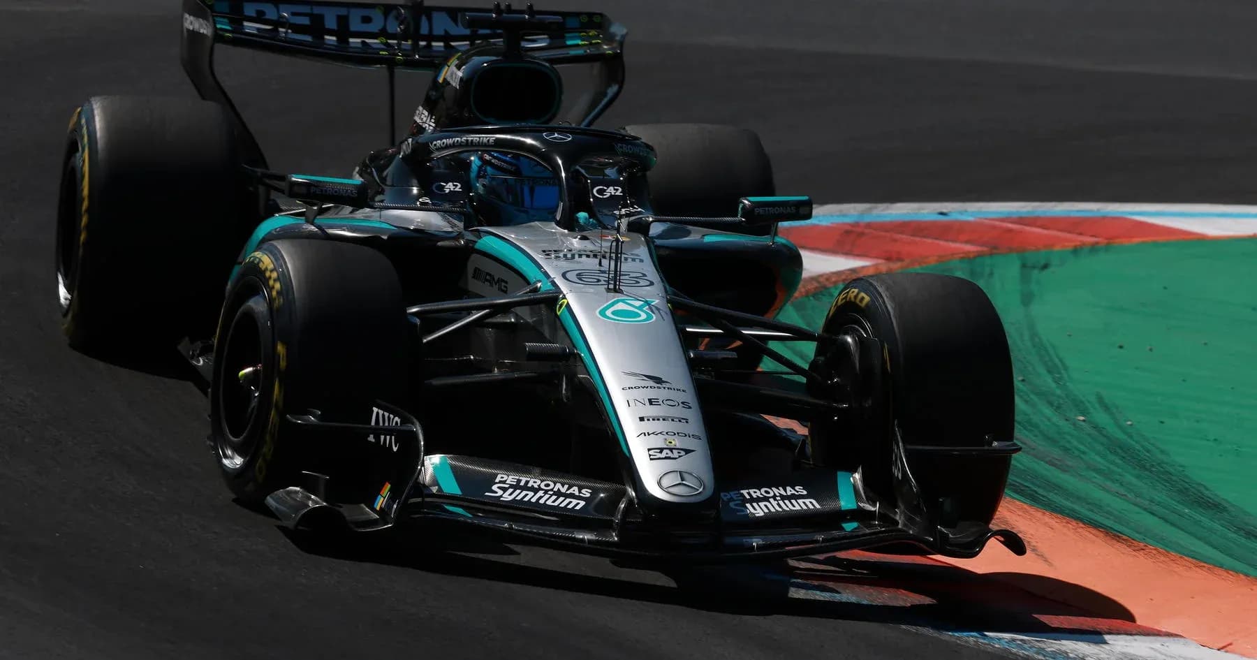 Mercedes Formula 1 car racing on track corner Mercedes Formula 1 car racing on track corner