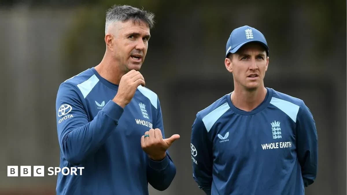 Coach discussing strategy with player during training Coach discussing strategy with player during training