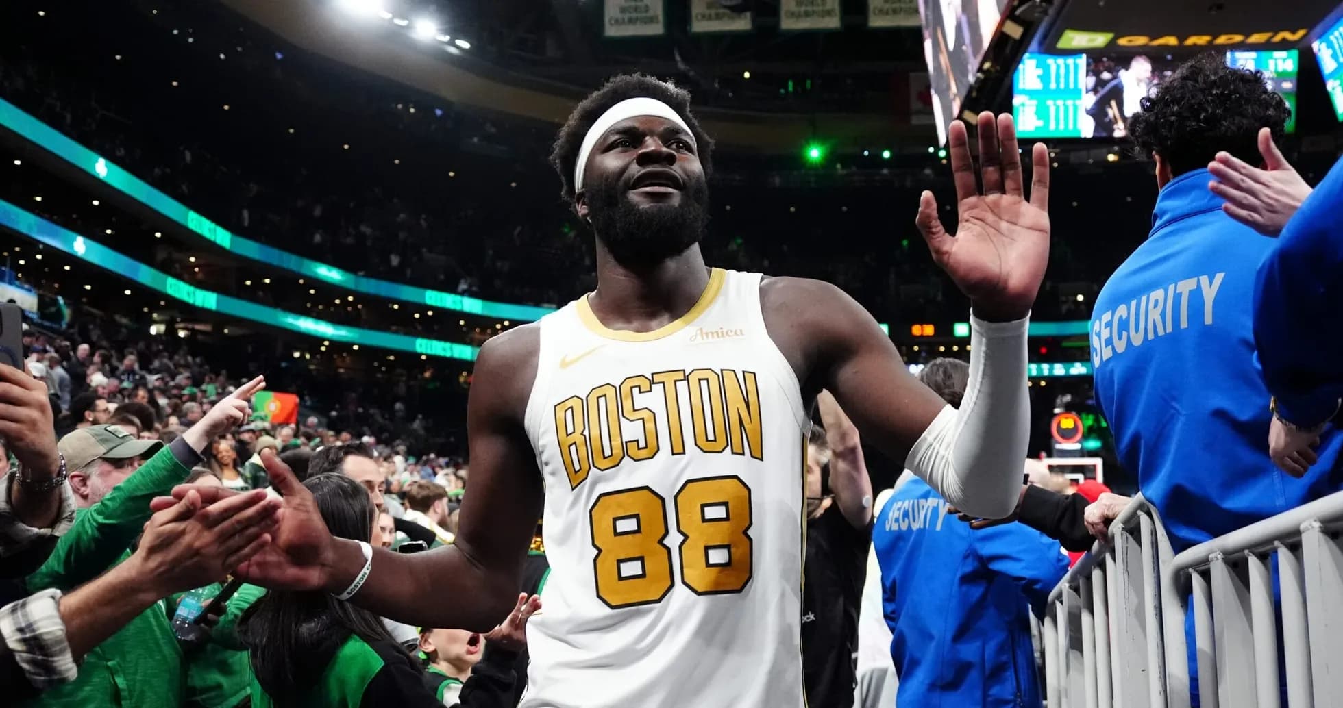 Player celebrating with fans after the game Player celebrating with fans after the game