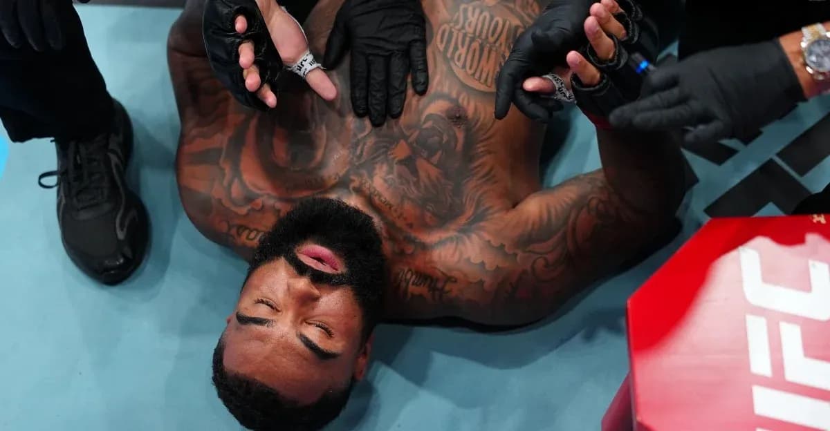 Fighter receiving medical attention on the mat Fighter receiving medical attention on the mat