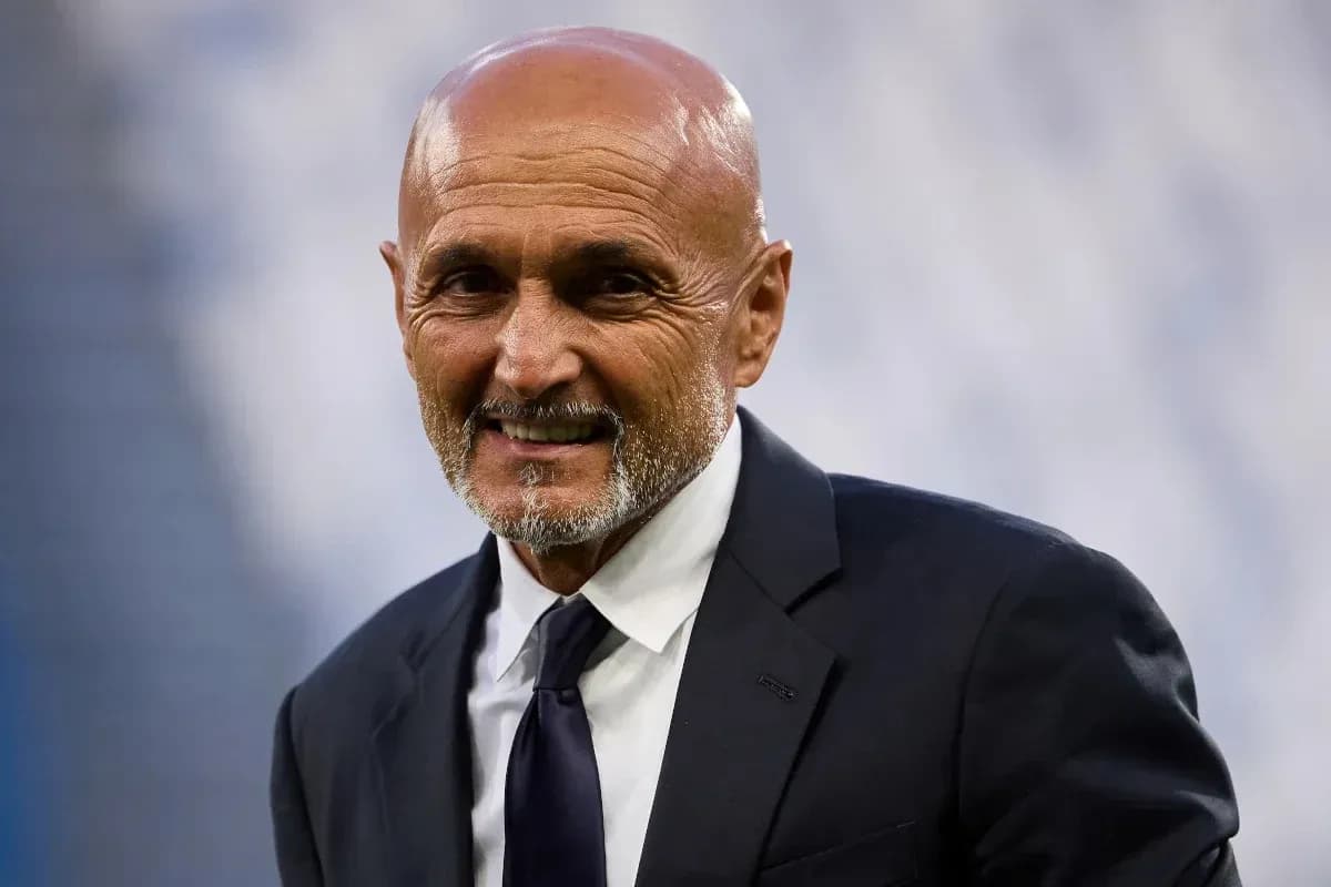 Man in suit smiling on the sidelines Man in suit smiling on the sidelines